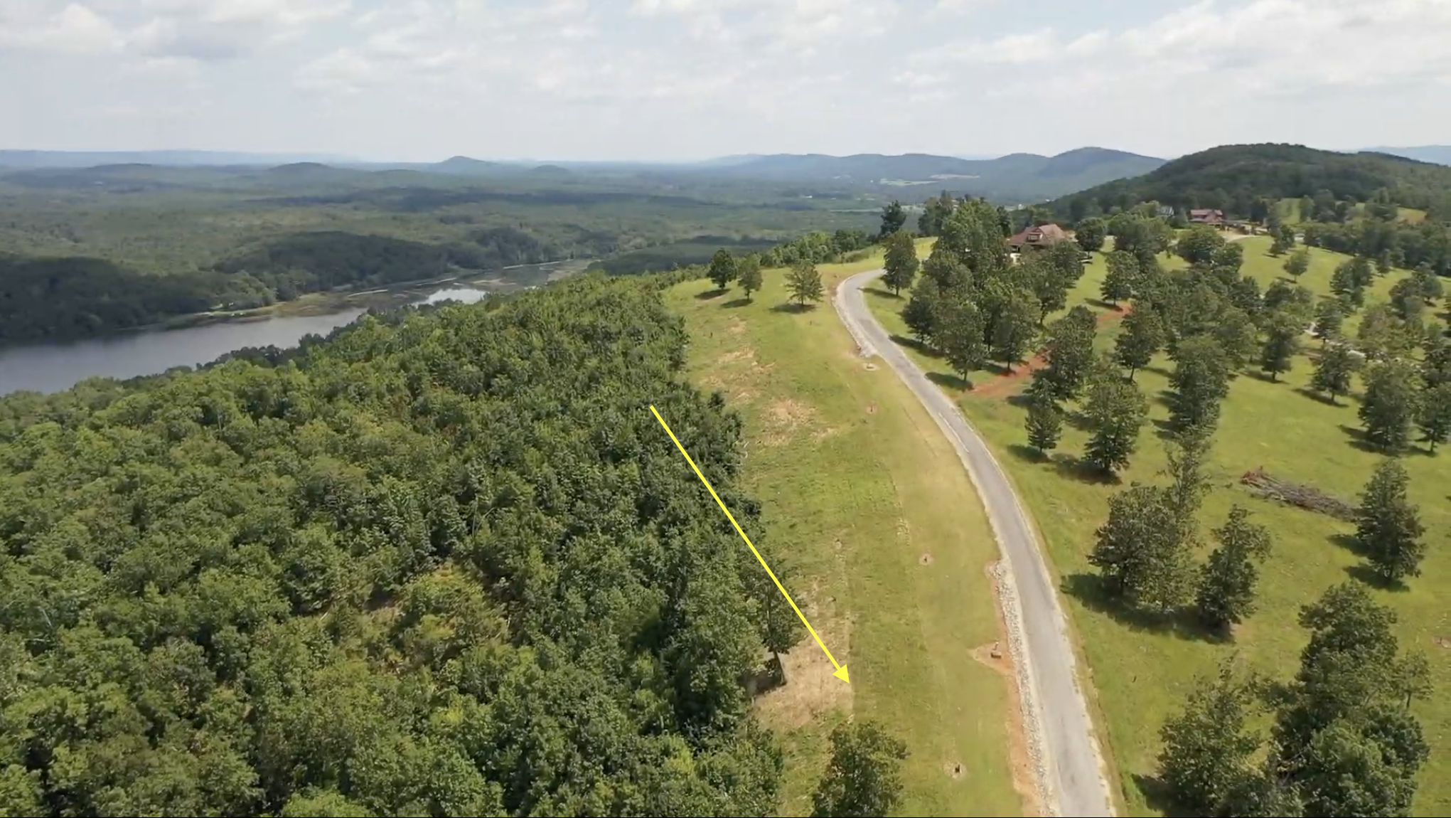 Property view showing natural wooded setting at The Bluffs
